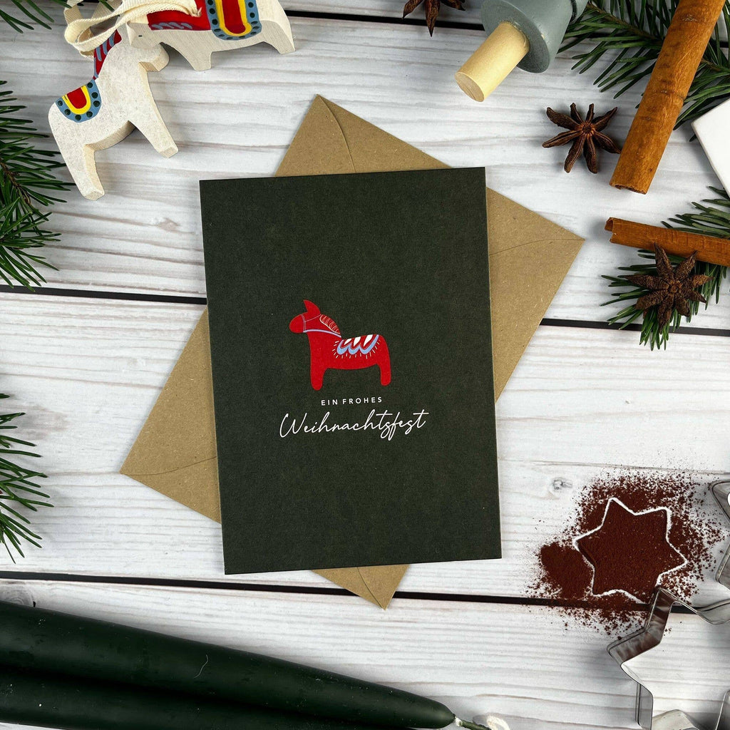 Postkarte „Ein frohes Weihnachtsfest“ – mit Dalapferd
