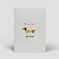 Postkarte „Happy Birthday“ – Partydackel mit Girlande